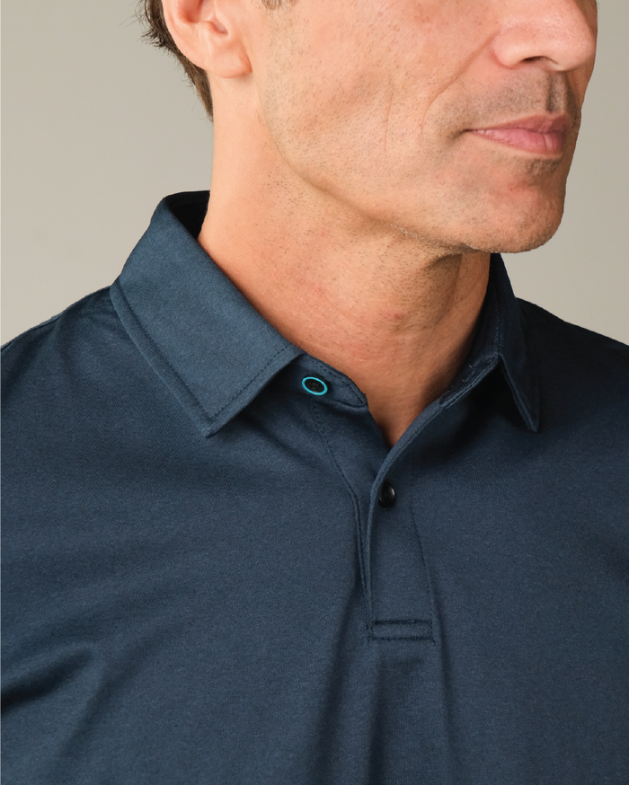 A midnight navy polo shirt with blue colored top butt ring