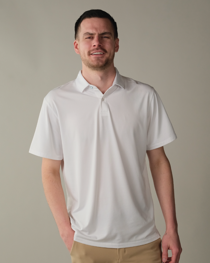 Man wearing a cloud white polo shirt