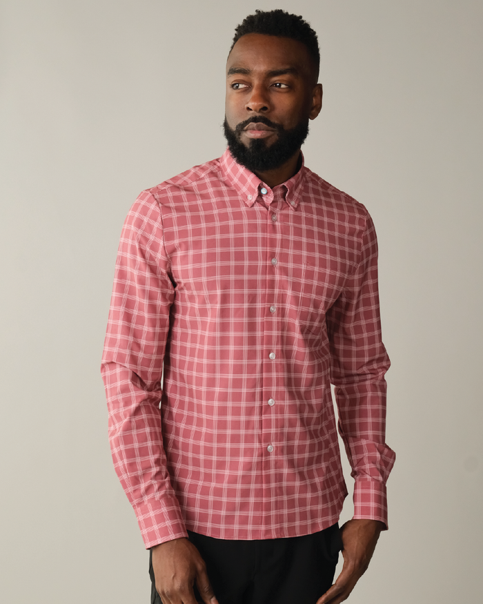 Man wearing adobe red with white windowpane shirt