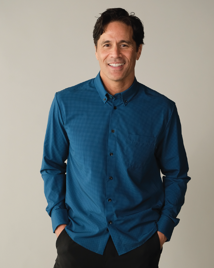 Man wearing dark blue with navy check shirt
