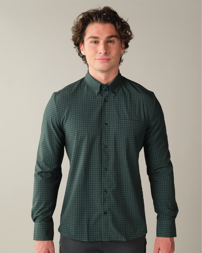 Man wearing forest green and navy gingham shirt.