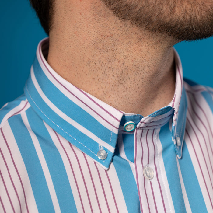 Man wearing Light blue and white shirt with mauve pinstripes. Top button has blue ring