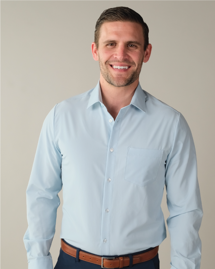 Man wearing a pale blue dress shirt