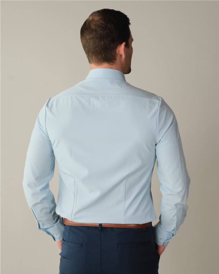 Man wearing a pale blue dress shirt