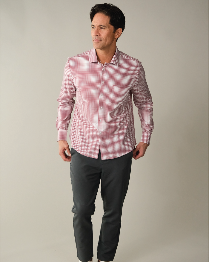 Man wearing a red and white checkered shirt with blue accent