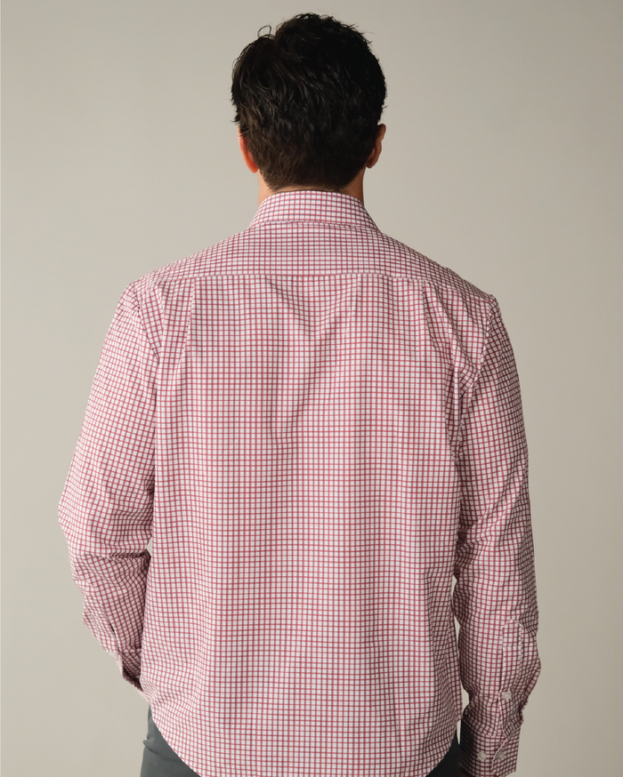 Man wearing a red and white checkered shirt with blue accent
