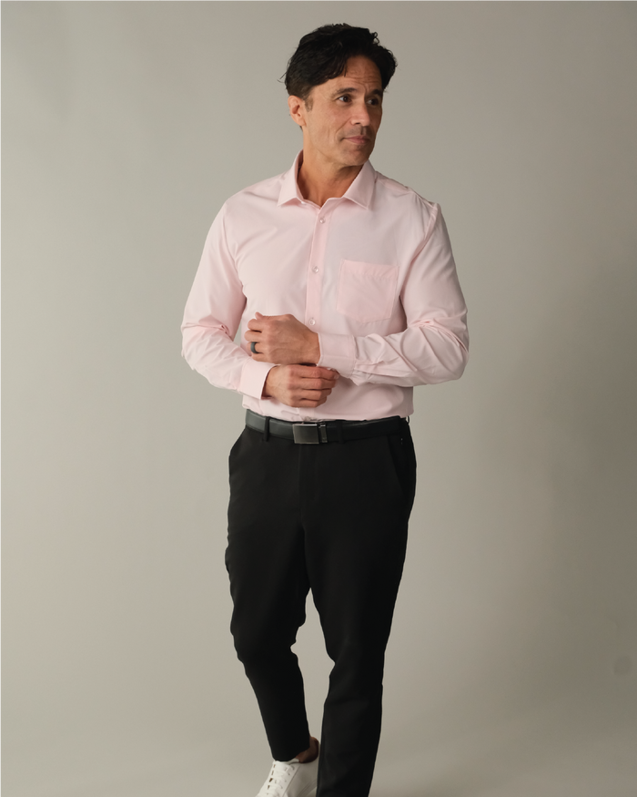 Man wearing a solid pink dress shirt