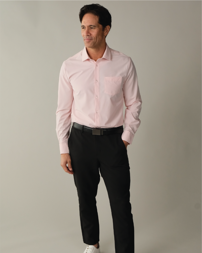 Man wearing a solid pink dress shirt