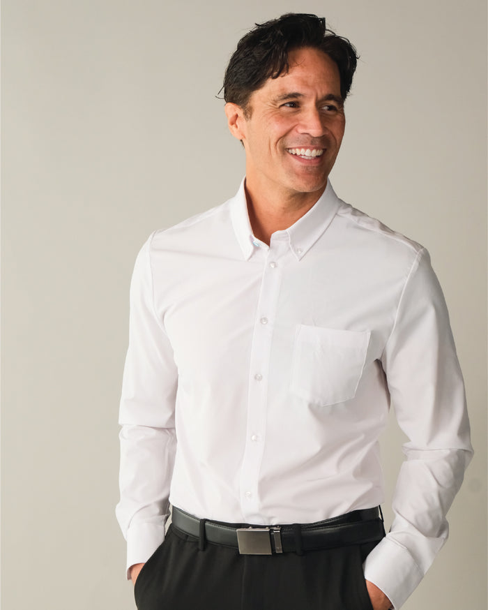 Man wearing a white button down collar dress shirt