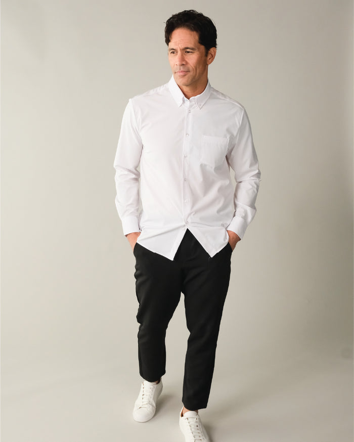 Man wearing a white button down collar dress shirt