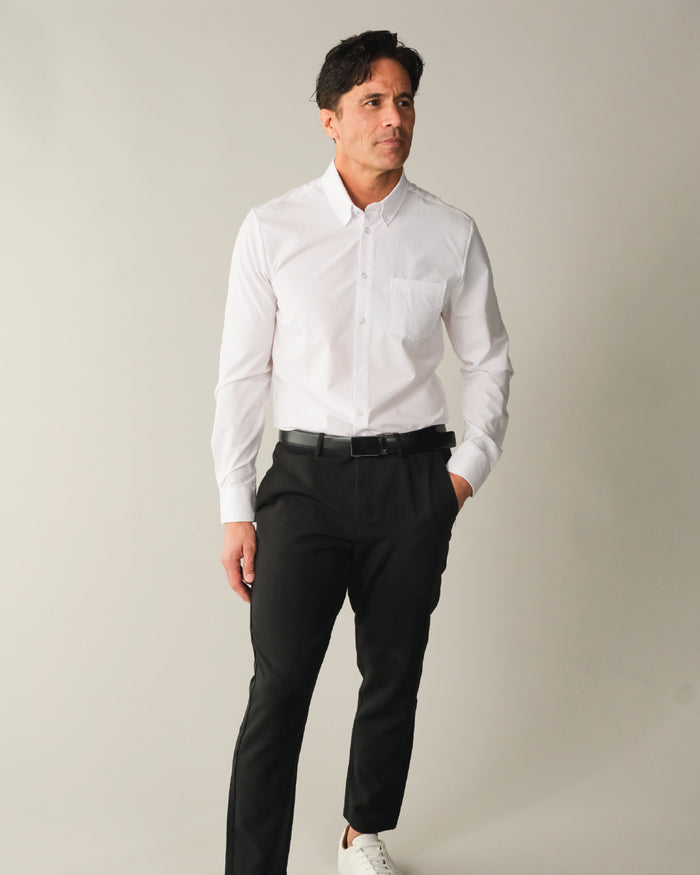 Man wearing a white button down collar dress shirt