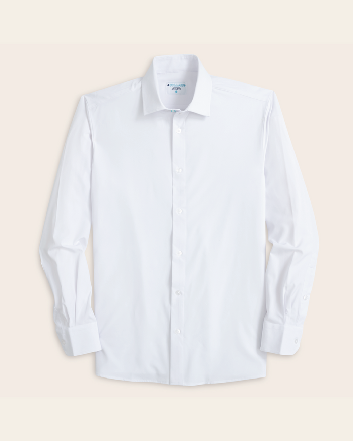 A white long sleeve performance dress shirt without a pocket.
