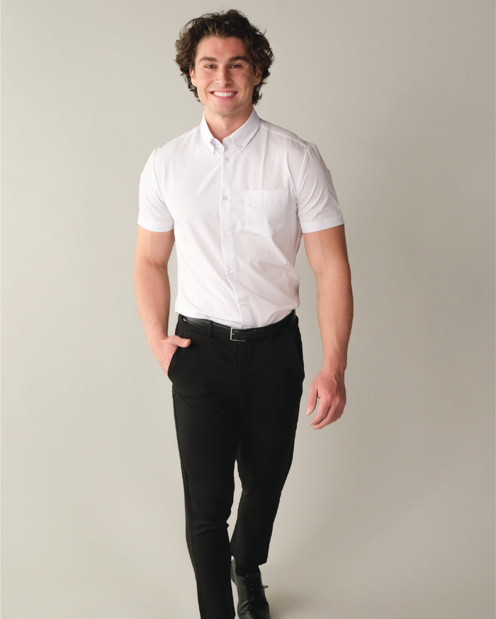 A man wearing a short sleeve white dress shirt