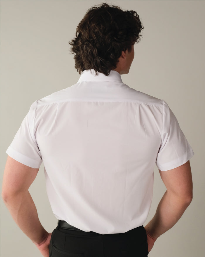Man wearing a short sleeve white dress shirt