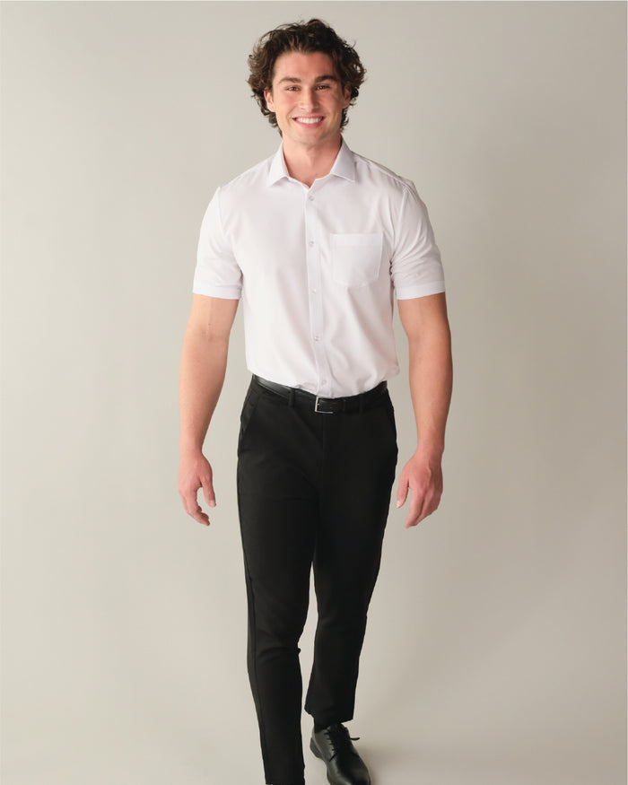 A man wearing a short sleeve white dress shirt