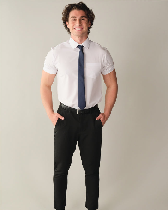Man wearing a short sleeve white dress shirt with blue tie