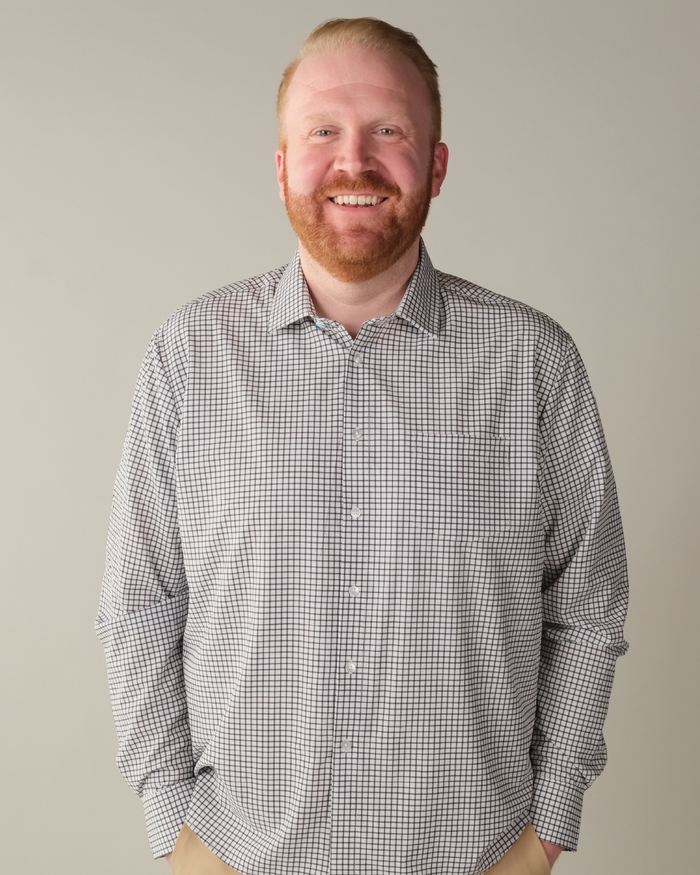 Man wearing white with black check shirt