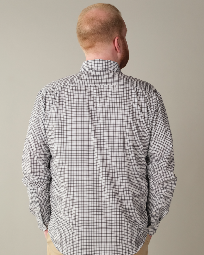 Man wearing white with black check shirt