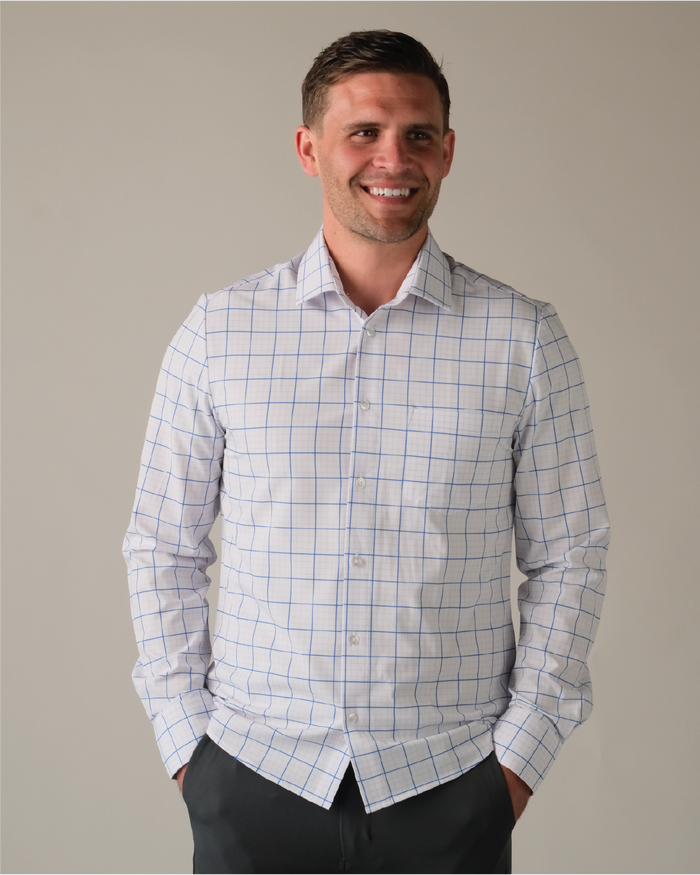 Man wearing a white shirt with navy and grey grids