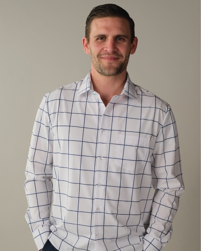 Man wearing a white shirt with navy windowpane