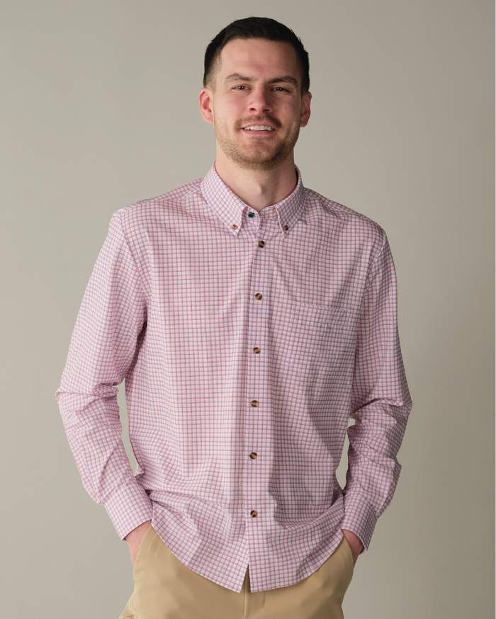 Man wearing white shirt with red and purple windowpane.