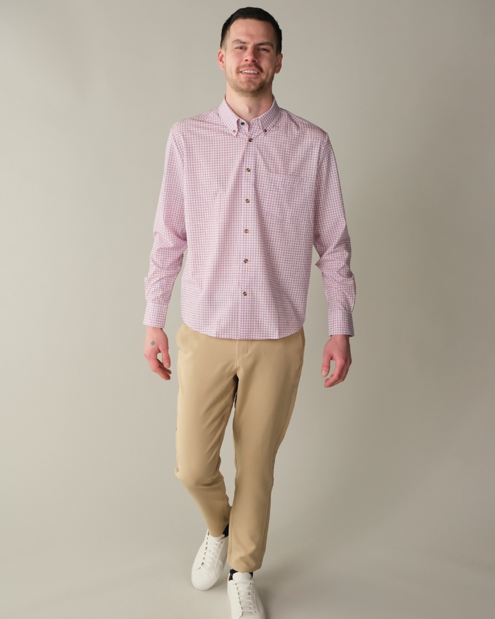 Man wearing white shirt with red and purple windowpane. Tortoise shell buttons.