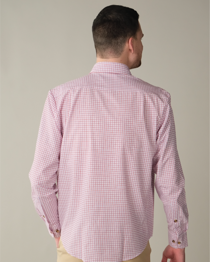 Man wearing white shirt with red and purple windowpane.
