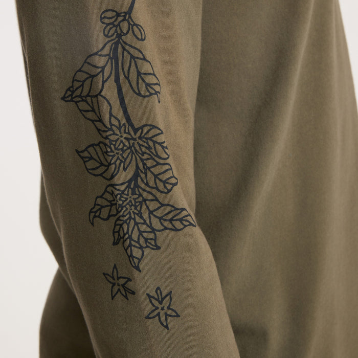 Sage green long sleeve tee with navy botanical line art print down the sleeve featuring leaves and star details
