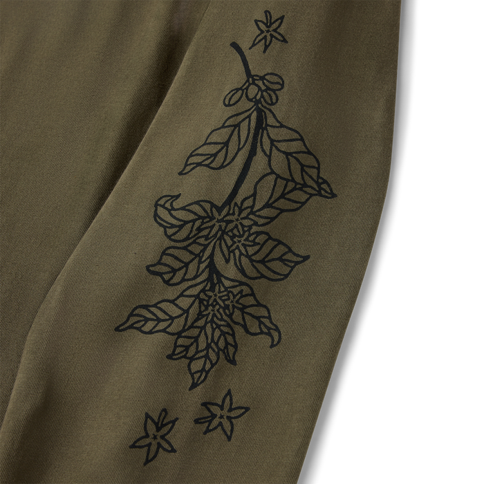 Sage green long sleeve tee with black line-drawn botanical tree and star design on front, flat lay detail shot