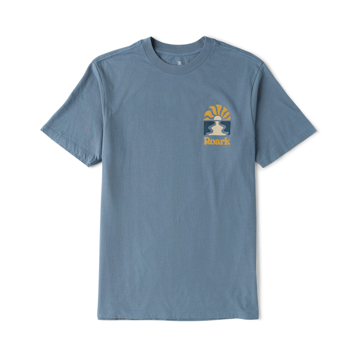 Slate blue short sleeve t-shirt with small Roark lion logo and sun graphic on chest, displayed flat on white background