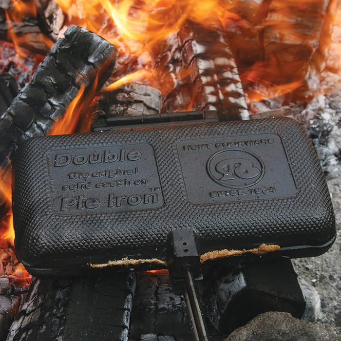 Rome Double Solid Cast Iron Pie Iron 1605 Closed on Burning Campfire Logs - Top Detail View | United RV Parts
