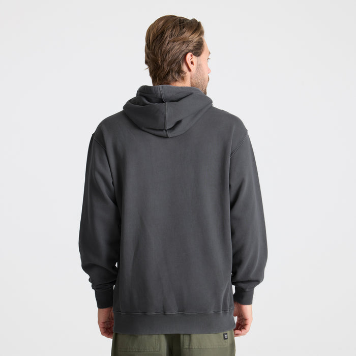 Close-up of a charcoal hoodie featuring a spacious pocket and adjustable hood, perfect for adventure and travel.