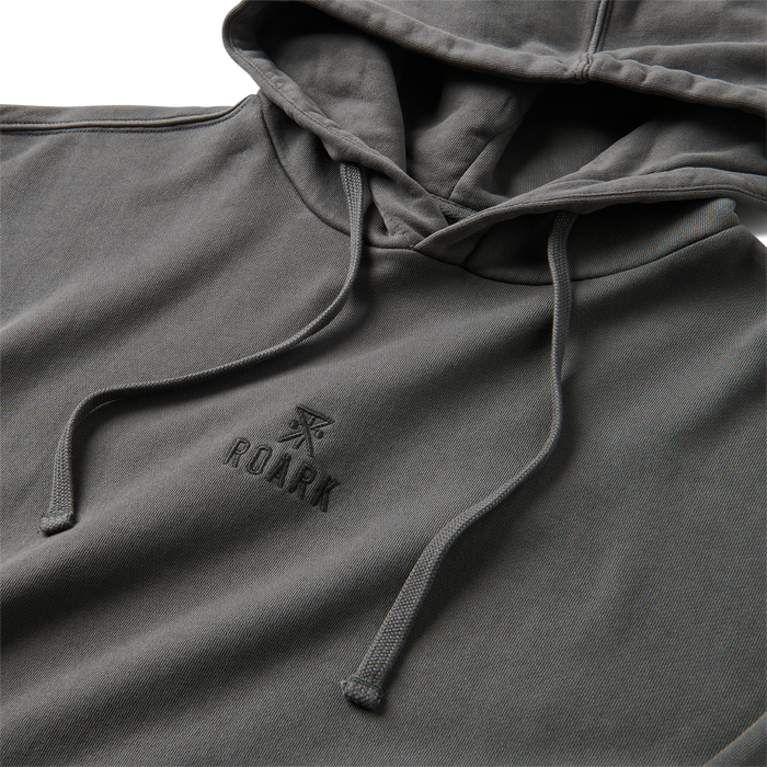 Roark adventurer exploring rugged terrain in outdoor apparel