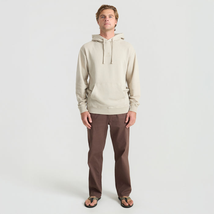 Close-up of a Roark adventure hoodie featuring a detailed hood and practical pocket design, perfect for travel and outdoor activities.