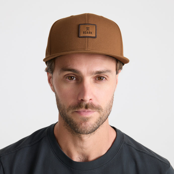 Assortment of stylish adventure hats including a sun hat, cap, and fedora, perfect for Roark's outdoor and travel enthusiasts.
