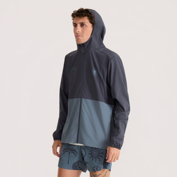 Navy and slate colorblock Second Wind Jacket worn by model with hood up, showing full front view of hooded windbreaker jacket