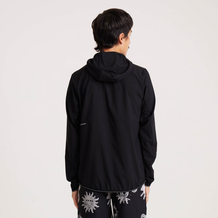 Back view of the Roark black windbreaker jacket, highlighting its clean, minimalist design and lightweight fabric for versatile wear.