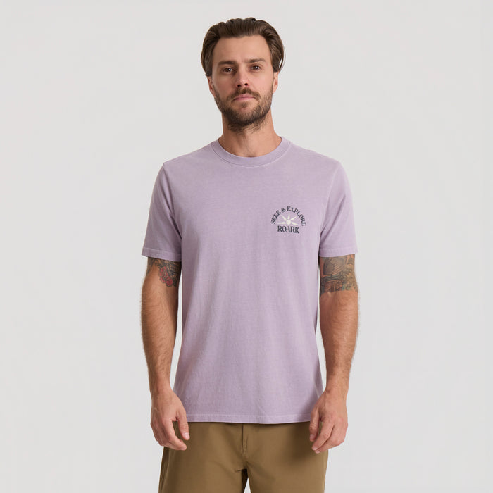 Active shirt designed for outdoor adventures displayed in a natural setting, embodying the essence of Roark's travel and adventure spirit.