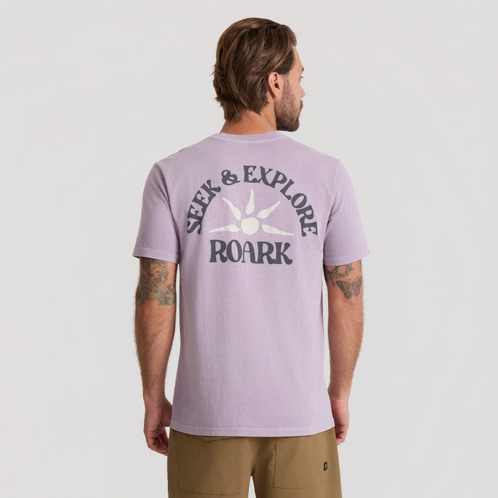 Active adventure shirt designed for outdoor activities and travel by Roark, displayed in a natural setting.