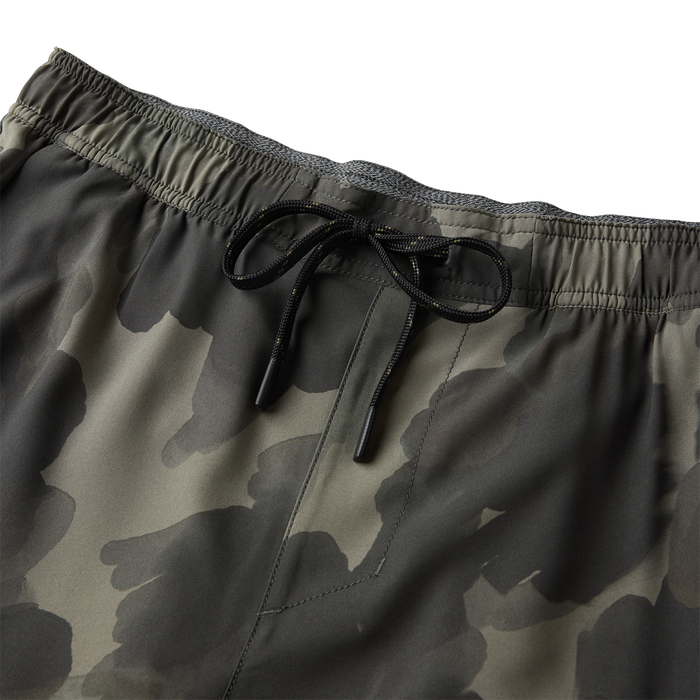 Serrano 7" Active Stretch Shorts in olive camo with black drawstring and elastic waistband, detail shot