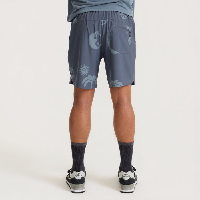 Serrano ebony active stretch shorts with celestial print, shown on model from waist down with black socks and sneakers