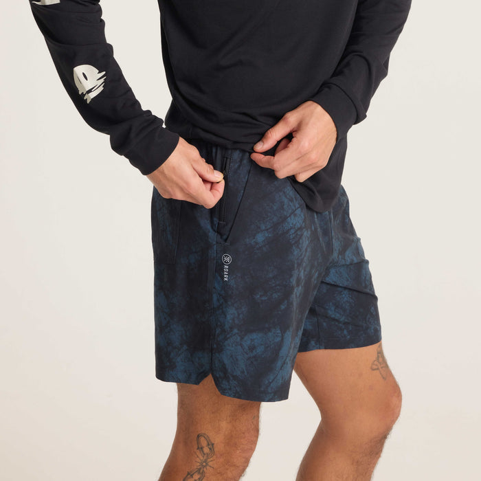 Side back view of navy tie-dye swim shorts, emphasizing a modern fit and minimal branding, ideal for outdoor and casual activities.