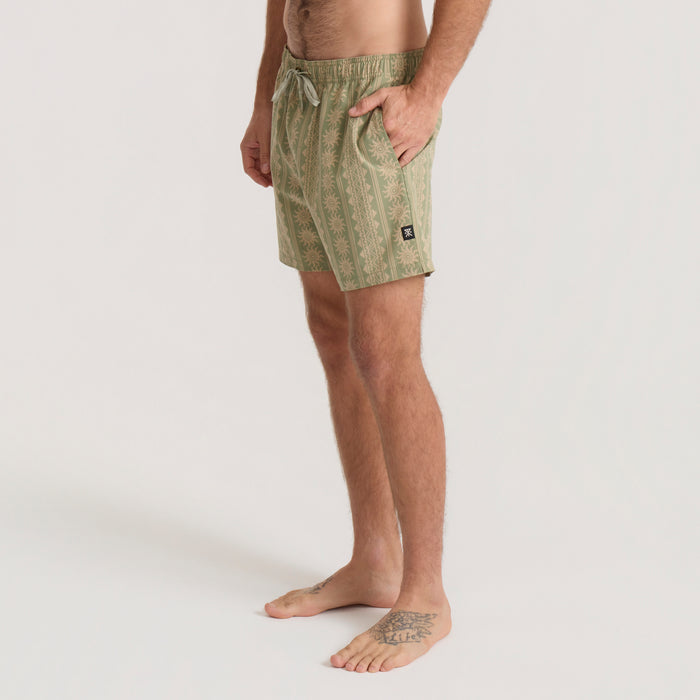 Shorey 16" trunks in dusty sage with vertical geometric pattern, worn by man on neutral background