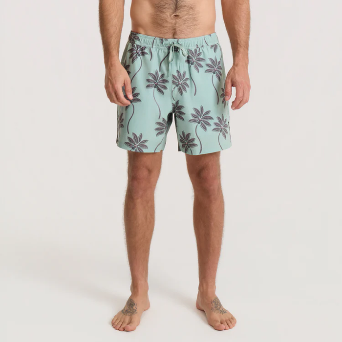 Shorey 16" trunks in hazy blue with dark purple floral print, worn by male model shown full length