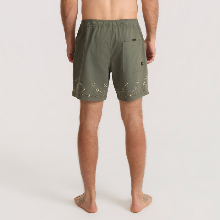 Roark Shorey Boardshorts in military green with embroidered details on hem, worn by man in back view