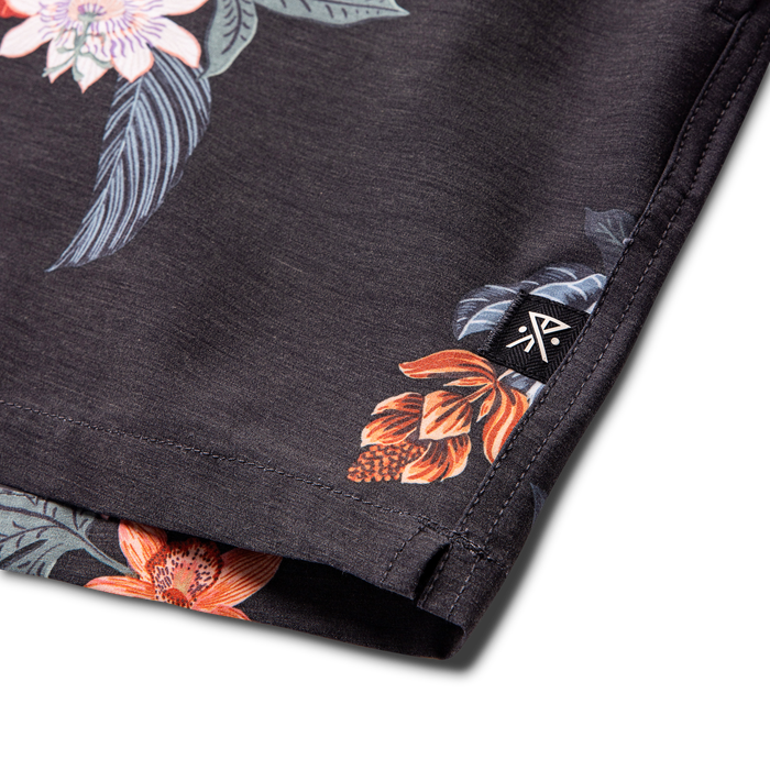 Stylish and rugged outdoor adventure gear by Roark, model RB491 in onyx black, displayed in a nature-inspired setting.