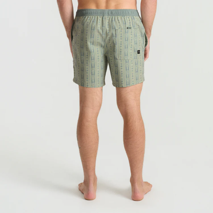 Man wearing sage green striped Shorey boardshorts with elastic waistband, shown from behind in full-length view