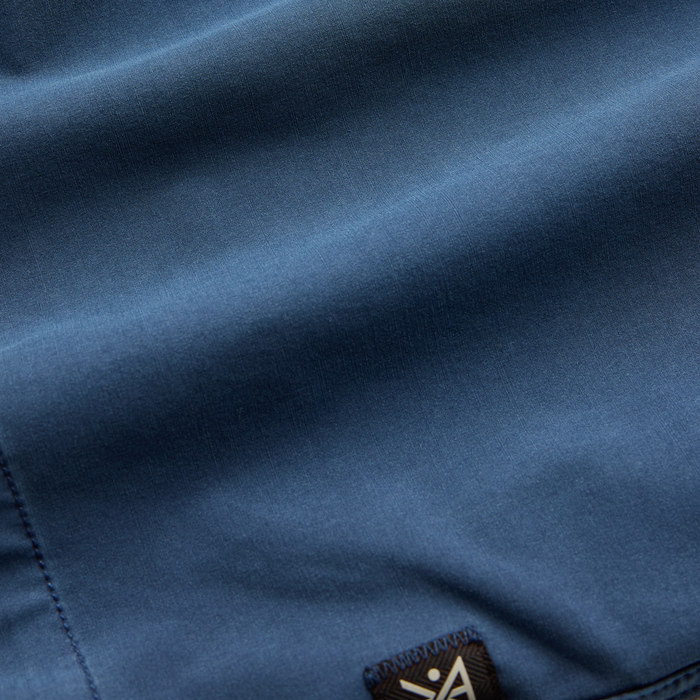 Blue adventure trunks with a detailed pocket, ideal for outdoor and travel activities