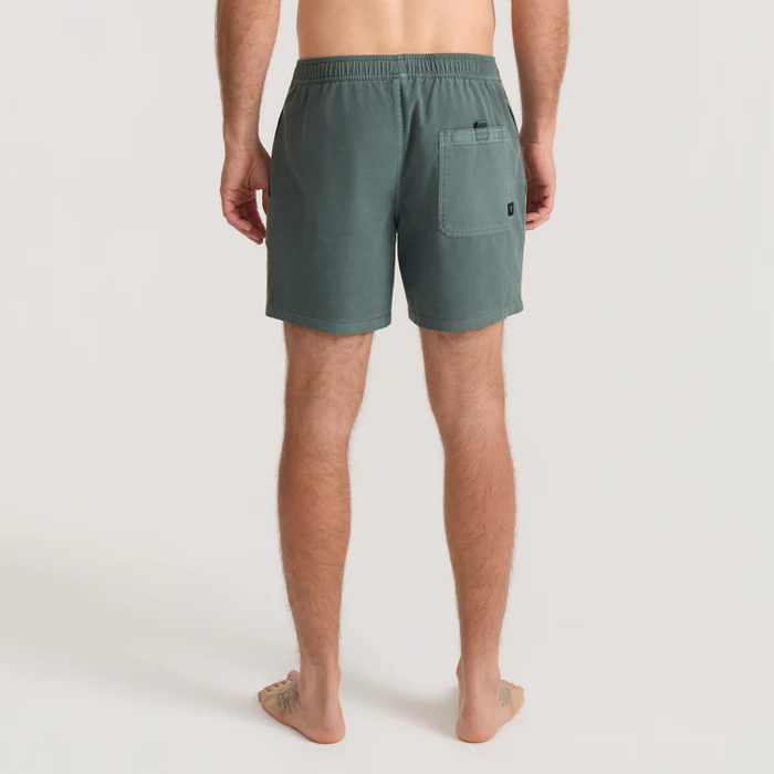 Washed slate green Shorey boardshorts on male model shown from back, featuring elastic waistband and rear pocket detail