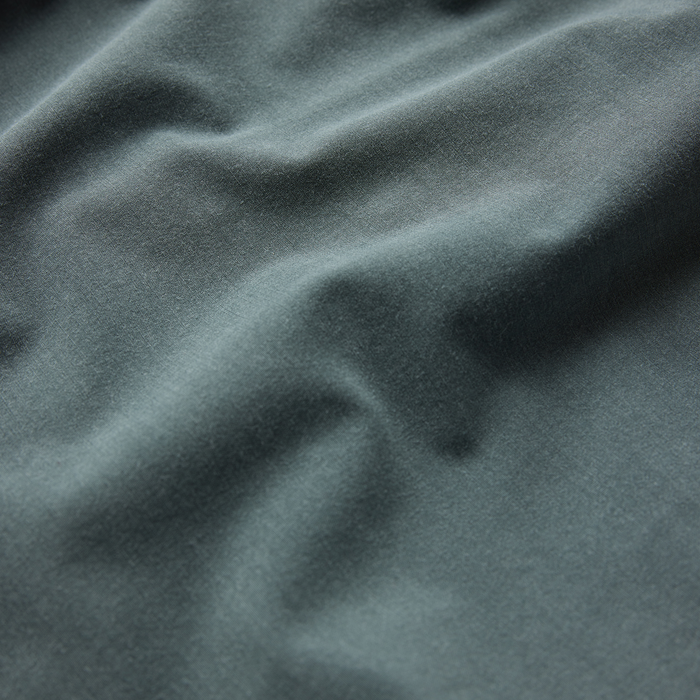 Shorey Boardshorts in washed slate green, close-up detail shot of soft fabric texture and natural draping